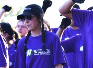 BETTER THAN EVER. During the homecoming parade, sophomore Allie Endo marches with the band. 